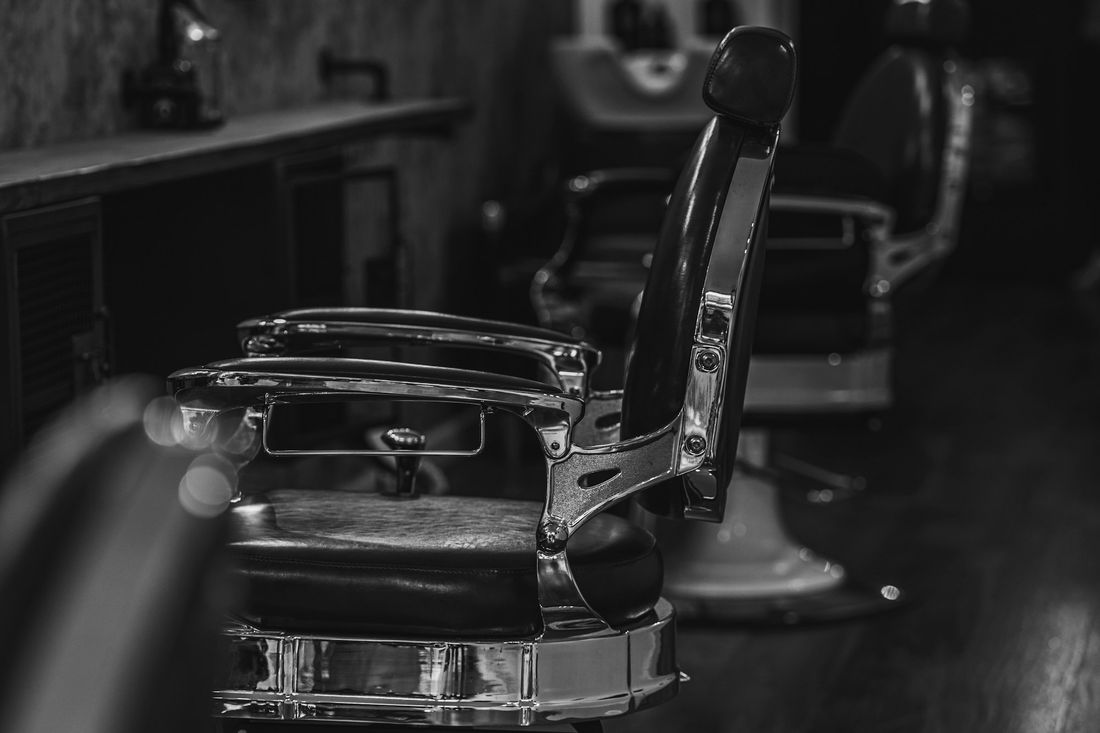 A classic black and chrome barber chair