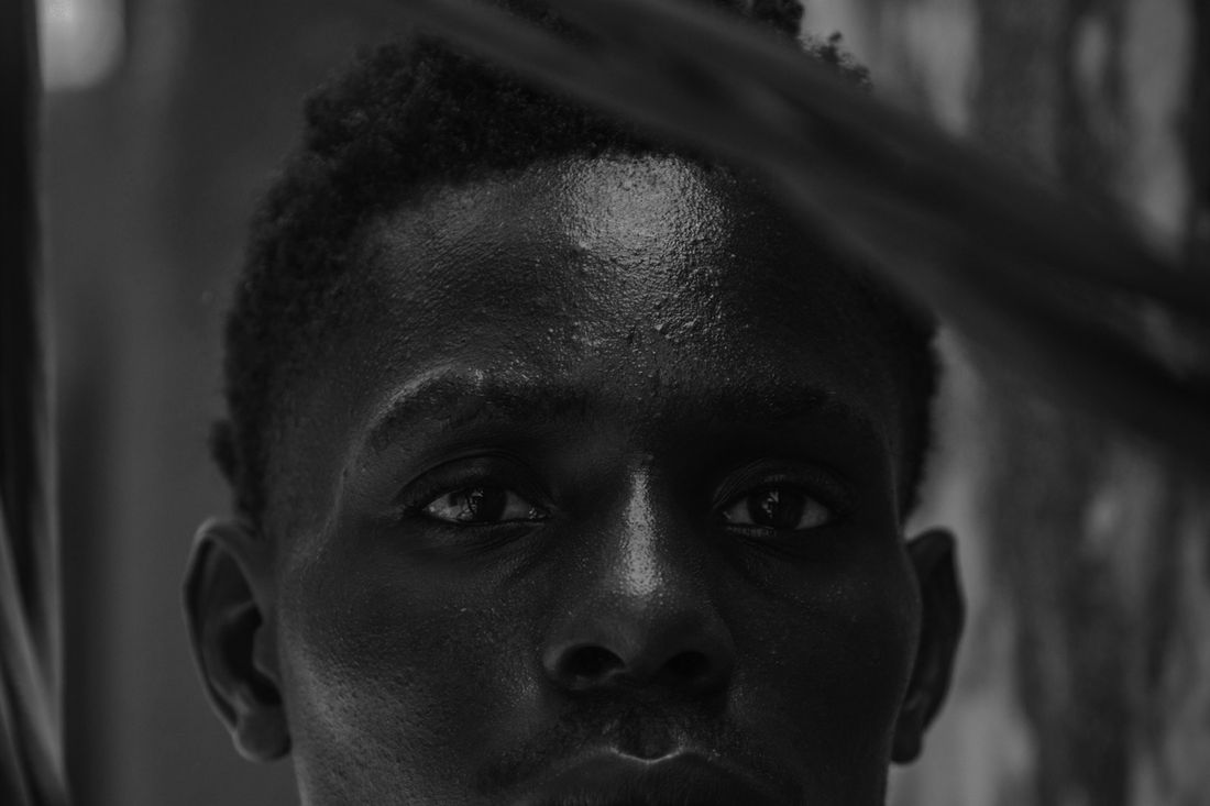 Portrait of a man in dark, moody light
