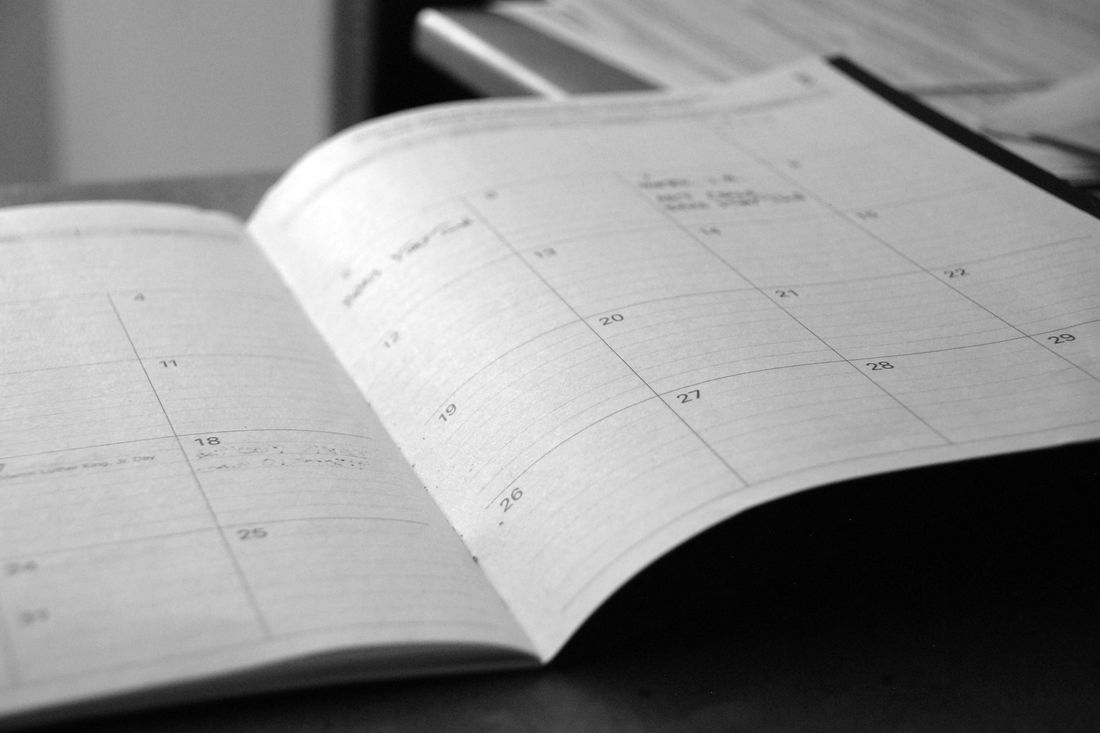 An open monthly planner on a desk