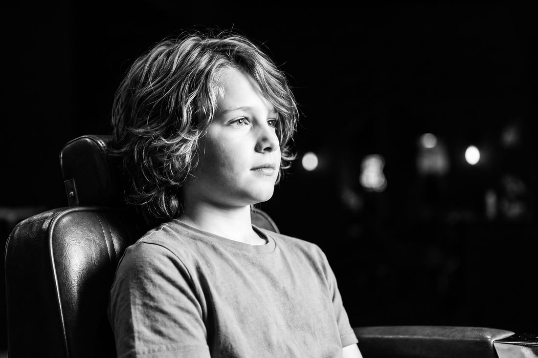 A boy with a grown-out layered shag haircut that moves without hard lines