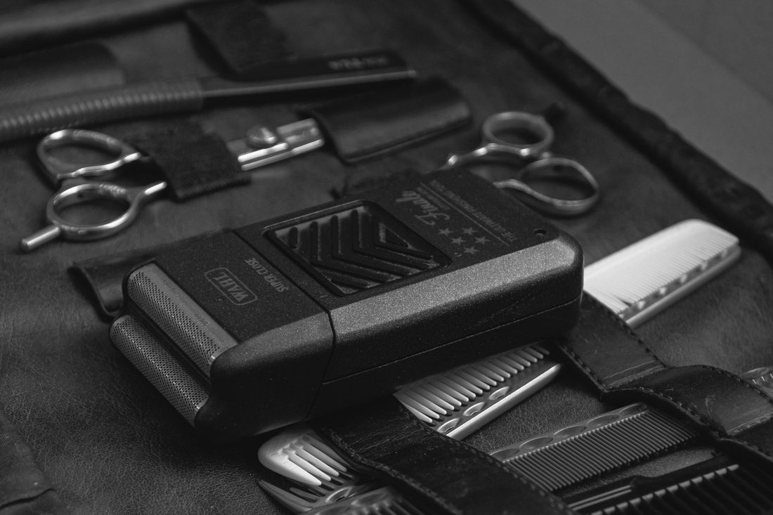 A case of neatly organized barber and grooming tools