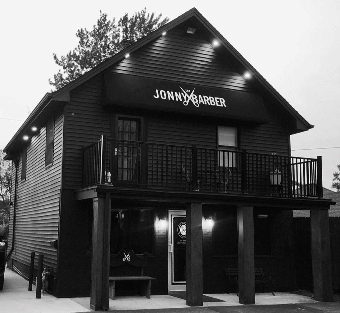 Jonny the Barber Tonawanda — the shop on Delaware St. at dusk